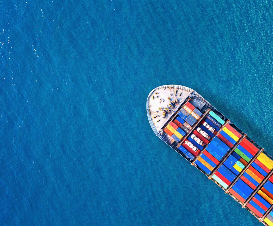 Aerial view of container cargo ship in sea.